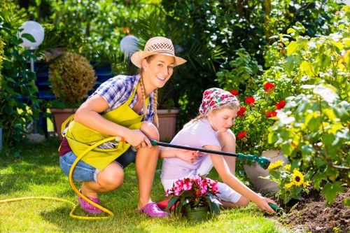 Professional garden landscaping details including edging, planting, and patio areas in Chessington